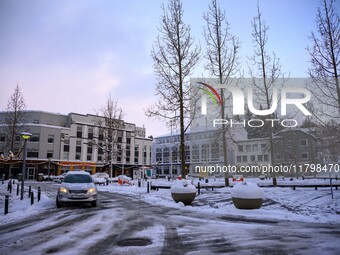 A car drives along one of the main streets in Akureyri, Iceland, on November 20, 2024. (