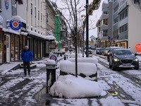 A person walks down a street in Akureyri, Iceland, on November 19, 2024. (