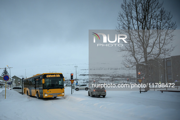 A bus drives along one of the main streets in Akureyri, Iceland, on November 20, 2024. 