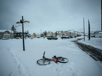 A bicycle is on the ground in a park in Akureyri, Iceland, on November 20, 2024. (