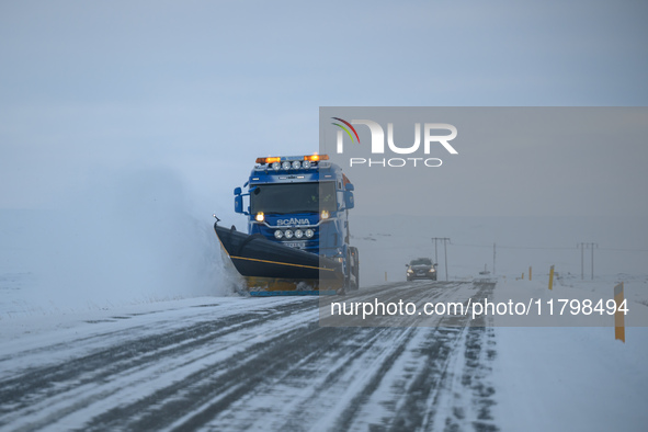 A snow plow clears the streets of snow in Akureyri, Iceland, on November 19, 2024. 