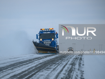 A snow plow clears the streets of snow in Akureyri, Iceland, on November 19, 2024. (