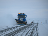 A snow plow clears the streets of snow in Akureyri, Iceland, on November 19, 2024. (