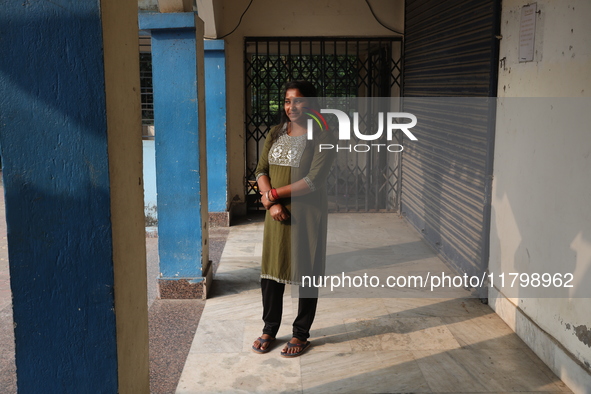 Tumpa Das, age 29, gestures before the cremation of a dead body in a furnace in a crematorium in the Baruipur Panchayat area in the South 24...