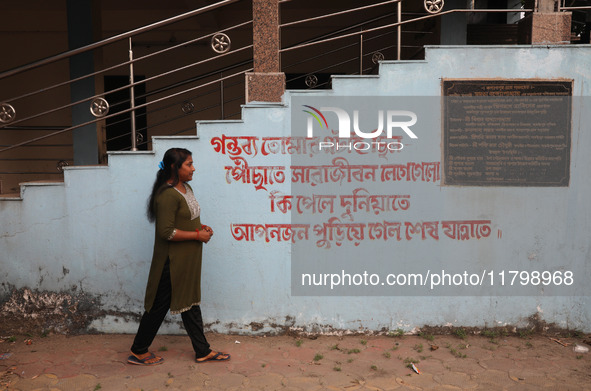 Tumpa Das, age 29, walks before the cremation of a dead body in a furnace in a crematorium at Baruipur Panchayat area in South 24-Pargana di...