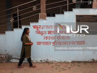 Tumpa Das, age 29, walks before the cremation of a dead body in a furnace in a crematorium at Baruipur Panchayat area in South 24-Pargana di...