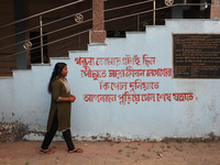 Tumpa Das, age 29, walks before the cremation of a dead body in a furnace in a crematorium at Baruipur Panchayat area in South 24-Pargana di...