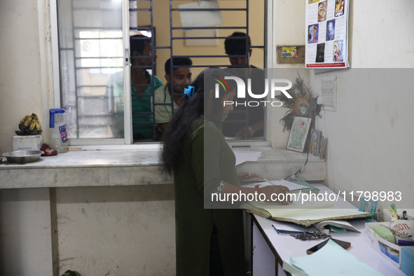 Tumpa Das, age 29, prepares a death certificate while cremating a dead body in a furnace inside a crematorium in the Baruipur Panchayat area...