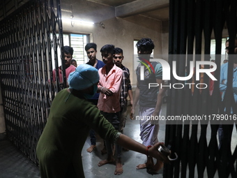 Tumpa Das, age 29, closes the gate before cremating a dead body in a furnace inside a crematorium in the Baruipur Panchayat area in South 24...