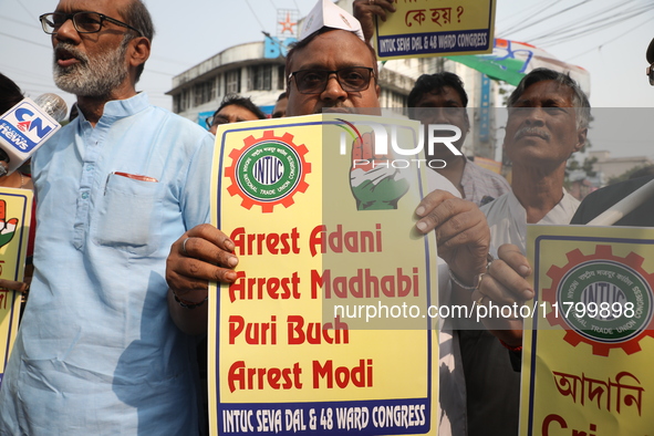 Supporters of India's main opposition Congress party participate in a protest rally against the Indian billionaire businessman Gautam Adani...