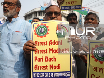 Supporters of India's main opposition Congress party participate in a protest rally against the Indian billionaire businessman Gautam Adani...