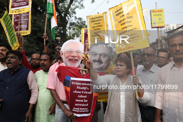 Supporters of India's main opposition Congress party participate in a protest rally against Indian Prime Minister Narendra Modi and billiona...