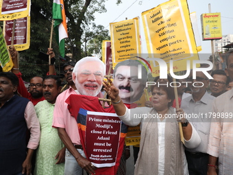 Supporters of India's main opposition Congress party participate in a protest rally against Indian Prime Minister Narendra Modi and billiona...