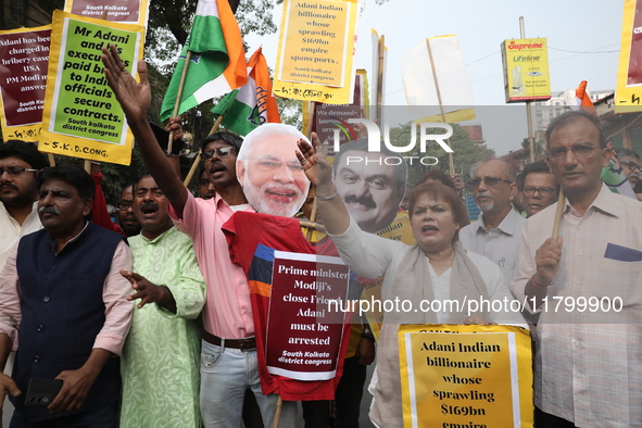 Supporters of India's main opposition Congress party participate in a protest rally against Indian Prime Minister Narendra Modi and billiona...