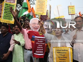 Supporters of India's main opposition Congress party participate in a protest rally against Indian Prime Minister Narendra Modi and billiona...