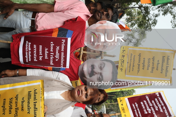 Supporters of India's main opposition Congress party participate in a protest rally against Indian Prime Minister Narendra Modi and billiona...