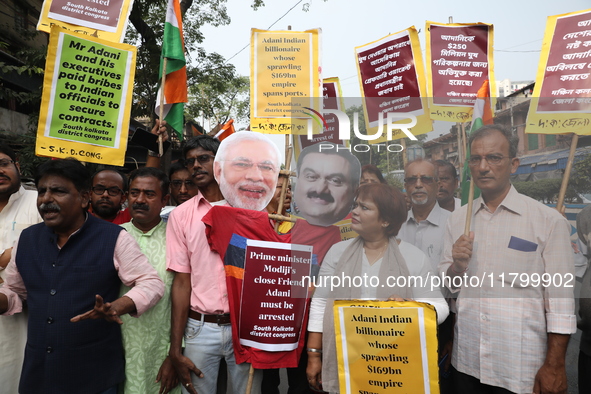 Supporters of India's main opposition Congress party participate in a protest rally against Indian Prime Minister Narendra Modi and billiona...