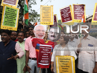 Supporters of India's main opposition Congress party participate in a protest rally against Indian Prime Minister Narendra Modi and billiona...