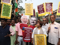 Supporters of India's main opposition Congress party participate in a protest rally against Indian Prime Minister Narendra Modi and billiona...