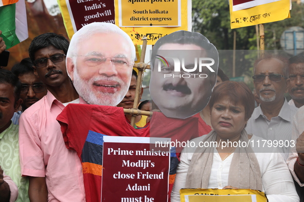 Supporters of India's main opposition Congress party participate in a protest rally against Indian Prime Minister Narendra Modi and billiona...