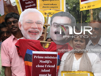 Supporters of India's main opposition Congress party participate in a protest rally against Indian Prime Minister Narendra Modi and billiona...