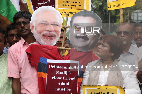 Supporters of India's main opposition Congress party participate in a protest rally against Indian Prime Minister Narendra Modi and billiona...