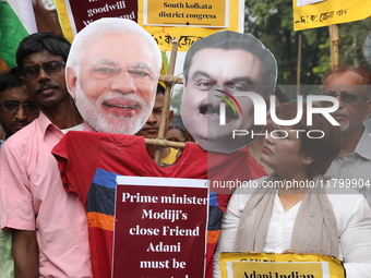 Supporters of India's main opposition Congress party participate in a protest rally against Indian Prime Minister Narendra Modi and billiona...