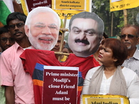 Supporters of India's main opposition Congress party participate in a protest rally against Indian Prime Minister Narendra Modi and billiona...