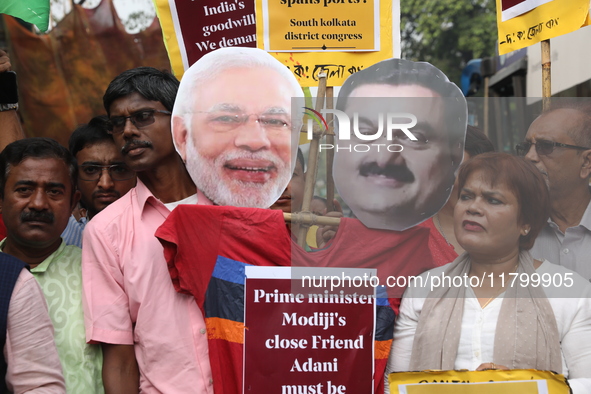 Supporters of India's main opposition Congress party participate in a protest rally against Indian Prime Minister Narendra Modi and billiona...