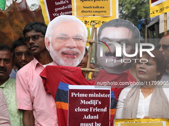 Supporters of India's main opposition Congress party participate in a protest rally against Indian Prime Minister Narendra Modi and billiona...