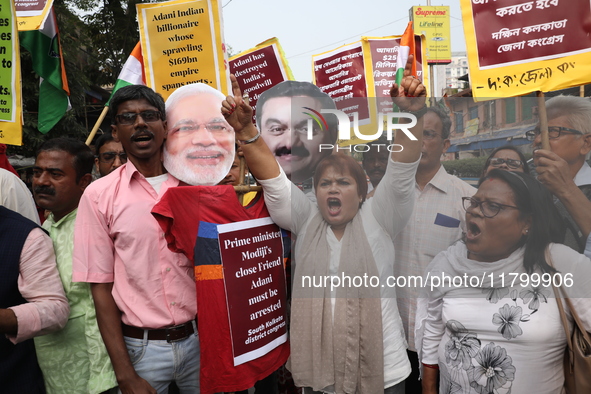 Supporters of India's main opposition Congress party participate in a protest rally against Indian Prime Minister Narendra Modi and billiona...