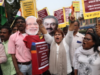 Supporters of India's main opposition Congress party participate in a protest rally against Indian Prime Minister Narendra Modi and billiona...