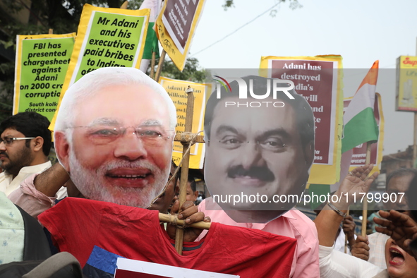 Supporters of India's main opposition Congress party participate in a protest rally against Indian Prime Minister Narendra Modi and billiona...