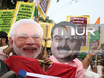 Supporters of India's main opposition Congress party participate in a protest rally against Indian Prime Minister Narendra Modi and billiona...