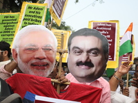 Supporters of India's main opposition Congress party participate in a protest rally against Indian Prime Minister Narendra Modi and billiona...