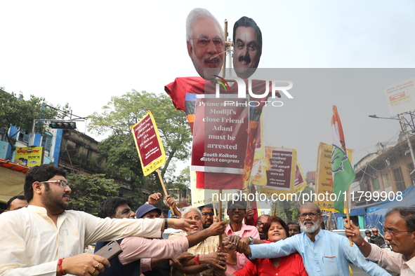 Supporters of India's main opposition Congress party participate in a protest rally against Indian Prime Minister Narendra Modi and billiona...