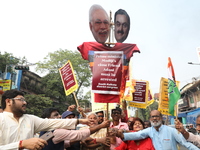 Supporters of India's main opposition Congress party participate in a protest rally against Indian Prime Minister Narendra Modi and billiona...