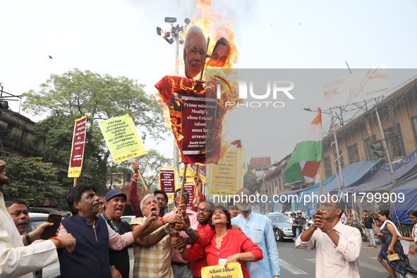 Supporters of India's main opposition Congress party participate in a protest rally against Indian Prime Minister Narendra Modi and billiona...