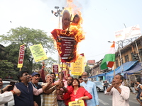 Supporters of India's main opposition Congress party participate in a protest rally against Indian Prime Minister Narendra Modi and billiona...