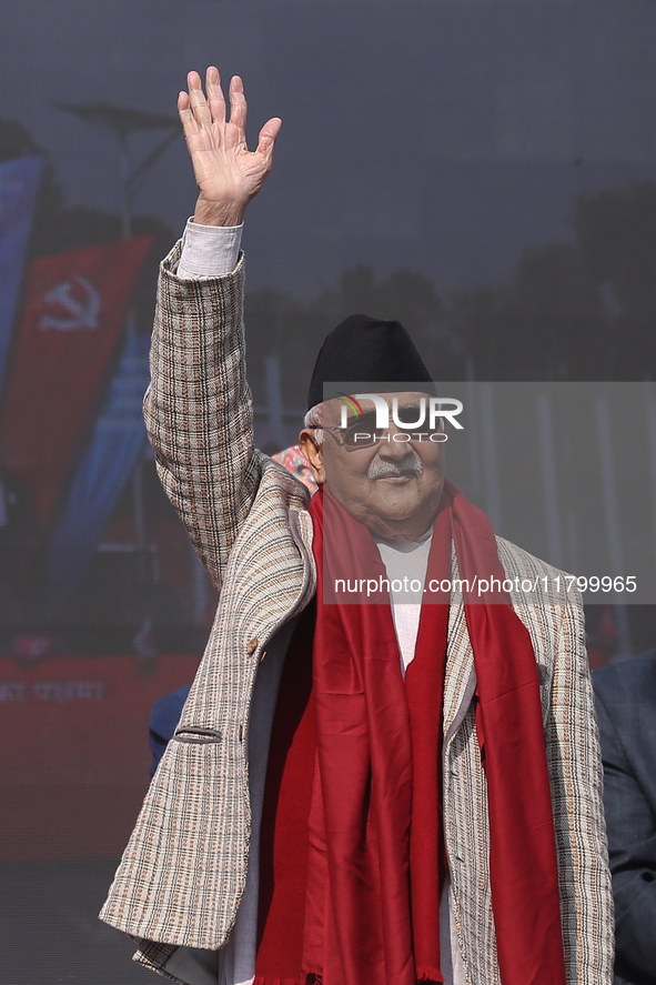 Nepal Prime Minister and chairman of CPN-UML (Communist Party of Nepal- Unified Marxist Leninist) KP Sharma Oli (Center) waves to the crowd...