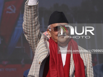 Nepal Prime Minister and chairman of CPN-UML (Communist Party of Nepal- Unified Marxist Leninist) KP Sharma Oli (Center) waves to the crowd...