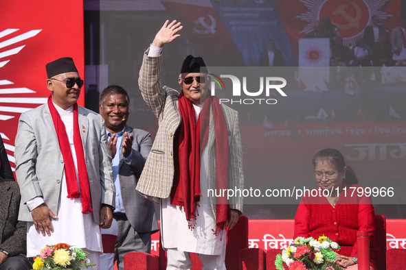 Nepal Prime Minister and chairman of CPN-UML (Communist Party of Nepal- Unified Marxist Leninist) KP Sharma Oli (Center) waves to the crowd...