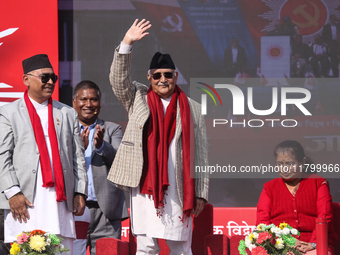 Nepal Prime Minister and chairman of CPN-UML (Communist Party of Nepal- Unified Marxist Leninist) KP Sharma Oli (Center) waves to the crowd...