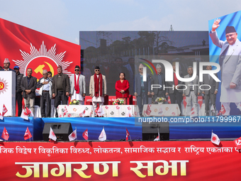 Nepal Prime Minister and chairman of CPN-UML (Communist Party of Nepal- Unified Marxist Leninist) KP Sharma Oli (sixth from left) stands alo...