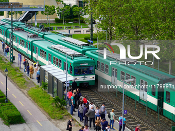 Passengers queue to board the suburban train at the Mupa-Nemzeti Szinhaz station in Budapest, Hungary, on May 19, 2023. The station is locat...