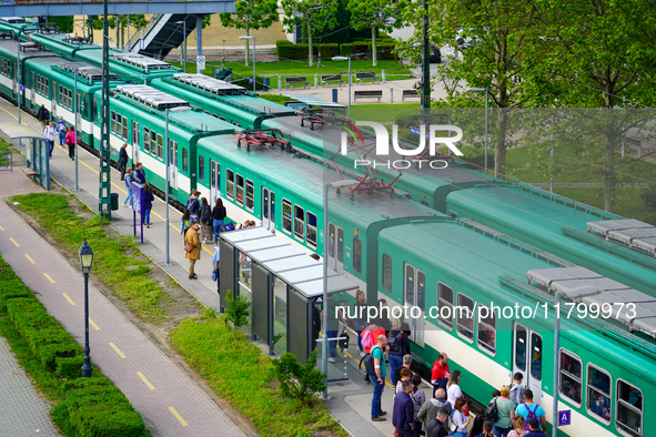 Passengers gather at the Mupa-Nemzeti Szinhaz suburban train station in Budapest, Hungary, on May 19, 2023. This station, adjacent to cultur...