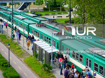 Passengers gather at the Mupa-Nemzeti Szinhaz suburban train station in Budapest, Hungary, on May 19, 2023. This station, adjacent to cultur...