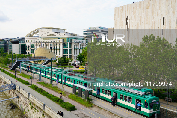 A suburban train stops at the Mupa-Nemzeti Szinhaz station in Budapest, Hungary, on May 19, 2023. Located near the Mupa cultural center and...