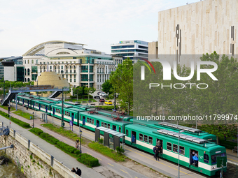 A suburban train stops at the Mupa-Nemzeti Szinhaz station in Budapest, Hungary, on May 19, 2023. Located near the Mupa cultural center and...