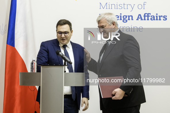 Ukraine's Foreign Minister Andrii Sybiha and Czech Republic's Foreign Minister Jan Lipavsky shake hands after a joint press conference in Ky...